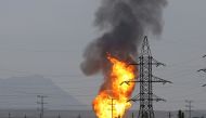 Smoke and flames rise after an explosion at a gas pipeline in Sangachal town 50 km from the capital of Azerbaijan, Baku on December 27, 2016 (Resul Rehimov / Anadolu Agency )