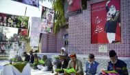 Supporters of Pakistan People's Party (PPP) of former Prime Minister, Benazir Bhutto, read the Holy Quran during a prayer ceremony held to mark her 9th death anniversary at Liaquat Bagh Park in Rawalpindi, Pakistan, yesterday.