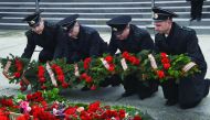 Russia's coast guard officers lay a wreath at a makeshift memorial in Sochi, yesterday.