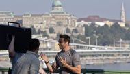File photo of Australian actor Hugh Jackman chatting with crew members on the 'Szabadsag' bridge in Budapest during a commercial film shooting. AFP / FERENC ISZA