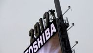 Workers prepare the New Year's eve numerals above a Toshiba sign in Times Square Manhattan, New York City, U.S., December 26, 2016. Picture taken December 26, 2016. REUTERS/Andrew Kelly
