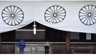 Visitors pray at the Yasukuni Shrine, which honours millions of Japanese war dead but also senior military and political figures convicted of war crimes after the second world war. Photo: AFP