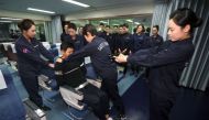 Korean Air is training crew to use more force to restrain violent passengers after an incident involving an unurly passenger prompted complaints (AFP Photo/STR).