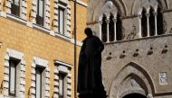 The main entrance of the Monte dei Paschi bank headquarters is seen in Siena, Italy, March 13, 2012. REUTERS/Max Rossi/File Photo
