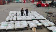 Shanghai customs officers checking pangolin scales at a port in Shanghai, yesterday.
