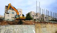 Earth-moving equipment stands in the disputed Israeli settlement of Ramat Shlomo after reports emerged that an additional 300 housing units are planned for this neighbourhood.
