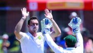 South African bowler Kyle Abbott (left) celebrates with a team-mate their win against Sri Lanka during the fifth and last day of the first Test at St George's Park ground in Port Elizabeth in South Africa yesterday.