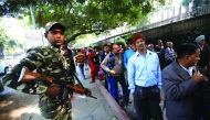 People queue outside the Reserve Bank of India to exchange their old high denomination bank notes, in New Delhi, yesterday.