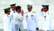 President Rodrigo Duterte returns the salute of a military officer as he leads the death anniversary celebration of Filipino national hero Dr Jose Rizal in Manila, yesterday.