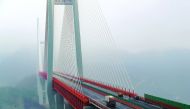 Vehicles making their way through the Beipanjiang Bridge, near Bijie in southwest China's Guizhou province.