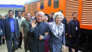Cambodia's King Norodom Sihamoni and his mother former queen Monique (center R) walk as Cambodia's Prime Minister Hun Sen (far L) accompanies them at the railway station in Phnom Penh on December 30, 2016. Cambodian King Norodom Sihamoni took the train fr