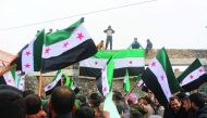 Syrians stage a protest against Assad Regime after Friday prayer at the Etarib district of Aleppo, Syria on December 30, 2016. (Ahmed al Ahmed - Anadolu Agency)