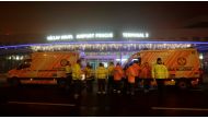 Rescue workers stand in front of the Vaclav Havel Airport after a passenger jet flying from Spain to Warsaw made an emergency landing due to a bomb threat, in Prague, Czech Republic, December 30, 2016. REUTERS/David W Cerny
