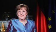 German Chancellor Angela Merkel poses for a photograph after the recording of her annual New Year's speech at the Chancellery in Berlin on December 30, 2016. / AFP / POOL / Markus Schreiber

