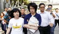FILE PHOTO -- Teen blogger Amos Yee leaves with his parents after his sentencing from the State Court in Singapore July 6, 2015. REUTERS/Edgar Su/File Photo
