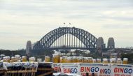 This picture taken on December 29, 2016 shows fireworks by the Sydney's New Year's Eve fireworks director Fortunato Foti on a barge in front of the Harbour Bridge in Sydney. AFP / Saeed KHAN 
