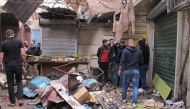 BAGHDAD, IRAQ - DECEMBER 31: Iraqis inspect the scene of suicide attacks at a bazaar in Baghdad, Iraq on December 31, 2016. At least 24 people were killed and dozens injured in a twin bombing claimed by Daesh terrorist group in the Iraqi capital Baghdad o