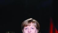 German Chancellor Angela Merkel poses for a photograph after the recording of her annual New Year's speech at the Chancellery in Berlin, yesterday.
