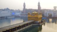 Indian Sikh devotees pay their respects on New Year's Day at the Golden Temple in Amritsar on January 1, 2017. AFP / Narinder NANU
