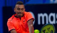 Nick Kyrgios of Australia hits a return against Feliciano Lopez of Spain during their second session men's singles match on day one of the Hopman Cup tennis tournament in Perth on January 1, 2017.  AFP / TONY ASHBY 
