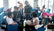 This photo taken on January 1, 2017 shows survivors gathering at a resting room after they were rescued from the burning passenger boat which was ferrying around 200 people off the coast of Jakarta to Tidung island, a tourist destination 50 kilometres (30