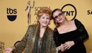 File photo of Debbie Reynolds and her daughter Carrie Fisher. AFP