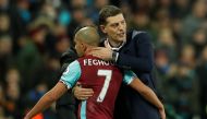 West Ham United's Sofiane Feghouli hugs West Ham United manager Slaven Bilic after being sent off. Reuters / John Sibley