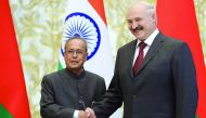 Belarus President Alexander Lukashenko shakes hands with his Indian counterpart Pranab Mukherjee at the Presidential Palace in Minsk yesterday.