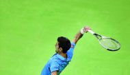 Novak Djokovic of Serbia hits a return to Radek Stepanek of Czech Republic during their Qatar ExxonMobil Open men's singles quarter-final played yesterday. Djokovic eased through to his first semi-final of the season and beat veteran Stepanek 6-3, 6-3.