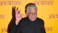 (FILES) This file photograph taken on September 3, 2014, shows Indian Bollywood actor Om Puri waving as he attends the UK Gala Screening of the film, The Hundred Foot Journey, in central London. AFP / JUSTIN TALLIS
