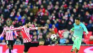 Athletic Bilbao's Eneko Boveda (left) vies for the ball possession with Barcelona's Neymar during their Spanish Copa del Rey match at the San Mames Stadium in Bilbao, Spain on Wednesday.