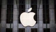 FILE PHOTO: An Apple logo hangs above the entrance to the Apple store on 5th Avenue in the Manhattan borough of New York City, July 21, 2015. REUTERS/Mike Segar/File Photo

