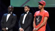 African best players from left, Senegalese Sadio Mane, Algerian Riyad Mahrez, and Gabonese Pierre-Emerick Aubameyang stands for the announcement of African Footballer of the Year in Abuja, on January 5, 2017.  AFP / PIUS UTOMI EKPEI
