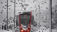 Seagulls fly as a tramway moves along the snow covered tramline during the heavy snowfall in Istanbul, Turkey on January 07, 2017. ( Arif Hüdaverdi Yaman - Anadolu Agency )
