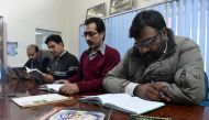 In this photograph taken on January 2, 2017, Pakistani men read Hindko language books at The Hindko Centre in Peshawar. Around a hundred women have gathered in a community centre in Peshawar, the heart of Pakistan's fabled northwest -- but they are conver