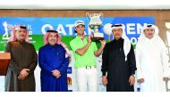 Netherlands'  Pierre Verlaar Jr poses for a photograph with Qatar Open Amateur Golf Championship trophy in the presence of Hassan Al Naimi, (second left) President of Qatar Golf Association (QGA), Fahad Al Naimi, (left) QGA General Secretary, Mohamed Al M