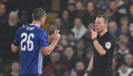 Chelsea's English defender John Terry (L) reacts just before Kevin Friend shows him a red card after a challenge on Peterborough United's English striker Lee Angol during the English FA Cup third round football match between Chelsea and Peterborough at St