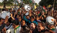 Women carrying kitchen utensils shout slogans during a protest organised by India's main opposition Congress party against demonetization in Chandigarh, India January 9, 2017. REUTERS/Ajay Verma