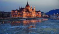Ice floes float in the water of the River Danube nearby the parliament building of Budapest, Hungary, yesterday. A cold snap gripping Europe has killed more than 30 people in recent days, left thousands of travellers stranded in snow-covered Turkey and br