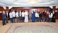 QIIB Chief Executive Officer, Abdulbasit Ahmad Al Shaibei and Deputy CEO Jamal Al Jamal with students of Qatar Academy at Banks headquarters.