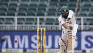 South African batsman Hashim Amla plays a shot during the third Test between South Africa and Sri Lanka on January 12, 2017 at Wanderers Cricket Stadium in Johannesburg. (AFP / MARCO LONGARI)
