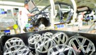 Emblems of VW Golf VII car are pictured in a production line at the plant of German carmaker Volkswagen in Wolfsburg.