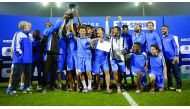 Aspire Academy’s U-16 team and officials celebrate after winning the Tri-Series in Doha.