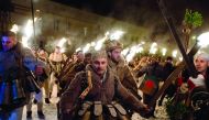 Bulgarian dancers dressed as animals perform a ritual dance with flaming torches during the Kukeri Carnival in the village of Batanovtsi, western Bulgaria, on January 13, 2017. The Kukeri Carnival is a festival of brightly colored masks and costumes which