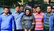 Bangladesh police escort alleged Islamist militant Jahangir Alam (C) in Dhaka on January 14, 2017, after his arrest in connection with an attack on the Holey Artisan Bakery attack last year. Bangladeshi police on January 14 said they arrested an Islamist 