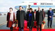Chinese President Xi Jinping (second left) and his wife Peng Liyuan (left), Swiss President Doris Leuthard (second right) and her husband Roland Hausin listen to the national anthems during a welcome ceremony upon their arrival for a state visit to Switze