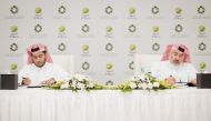 Sheikh Thani bin Thamer Al Thani and Abdulla Hassan Al Mehshadi signing the agreement.