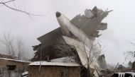 Plane debris is seen at the crash site of a Turkish cargo jet near Kyrgyzstan's Manas airport outside Bishkek, January 16, 2017. REUTERS/Vladimir Pirogov