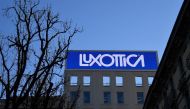 This picture taken on January 16, 2017 shows the logo of Italian eyewear company Luxottica in Milan.  AFP / Alberto PIZZOLI
