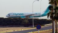 (FILES) This file photo taken on January 12, 2017 shows a plane from the low-cost Saudi carrier flynas as it taxies on the tarmac at the King Khalid International Airport in Riyadh on January 12, 2017. AFP / FAYEZ NURELDINE
